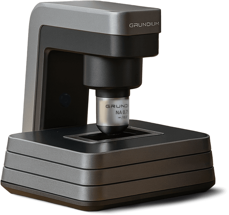 ParaScout AI automated microscope scanner connected to a monitor showing the diagnostic platform.